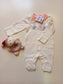 Rabbit P.R on White and pink Sleepsuit
