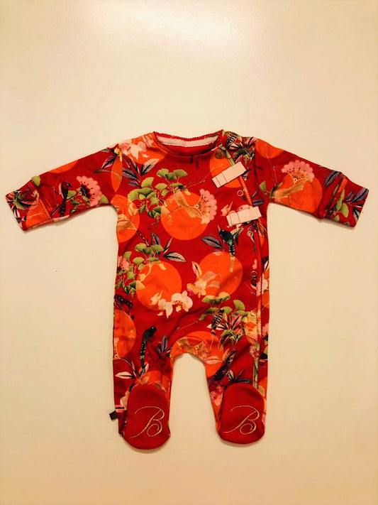 Flower pattern on red sleepsuit 4.5kg